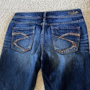 VINTAGE FLARED JEANS MID-RISE